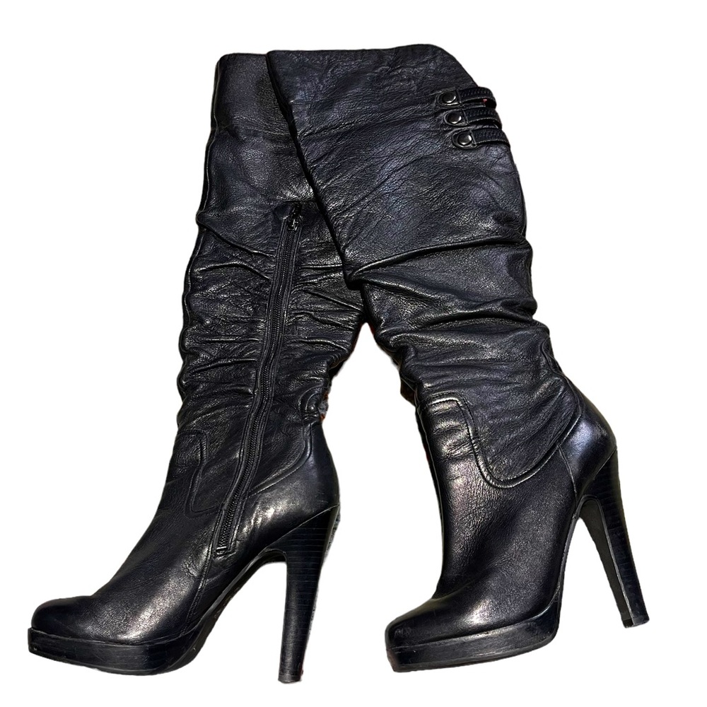 Extra tall black leather Jessica Simpson high heeled boots.
